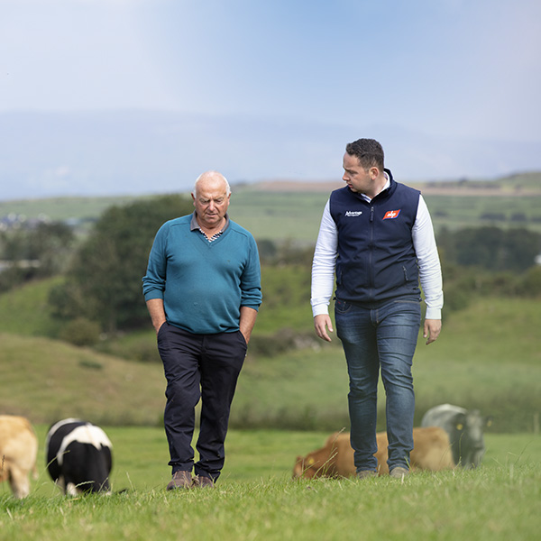 ABP representative walking a field with a farmer