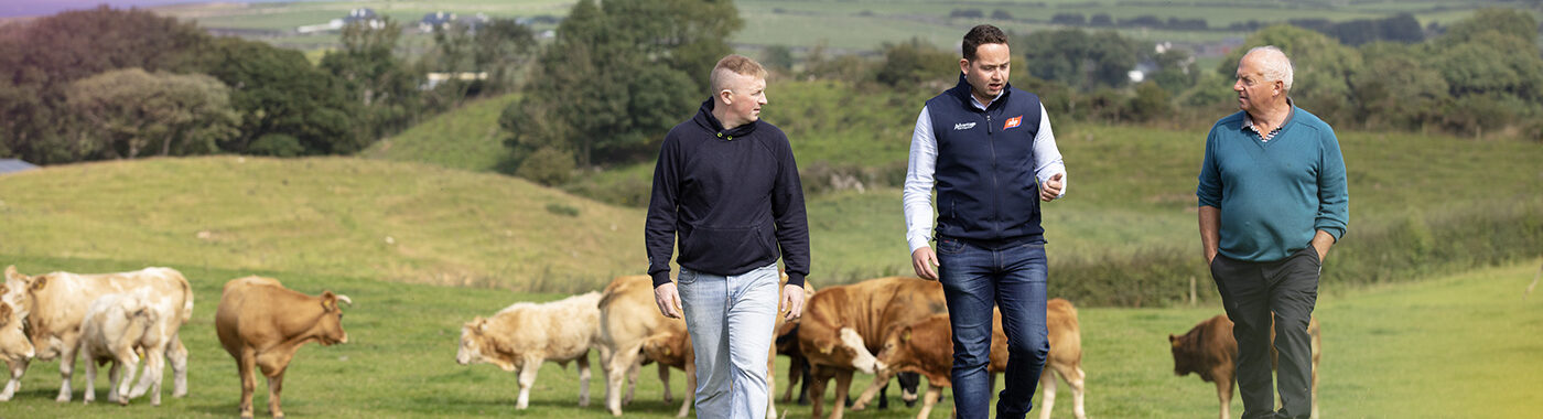 ABP Ireland representative with a farmers in a field