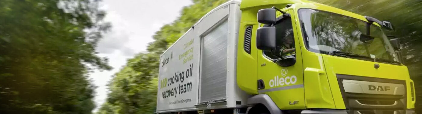 Olleco truck traveling down a busy road